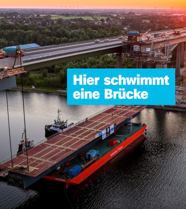 Hier schwimmt eine Brücke; Die Rader Hochbrücke wird bei Sonnenaufgang fertiggestellt.
