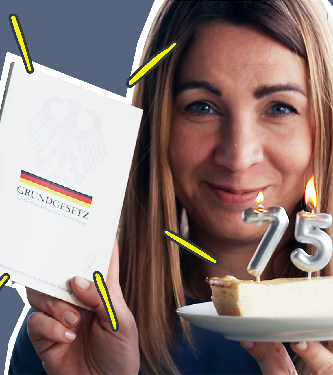 Magdalena mit dem Grundgesetz und einer 75. Geburstagskerze