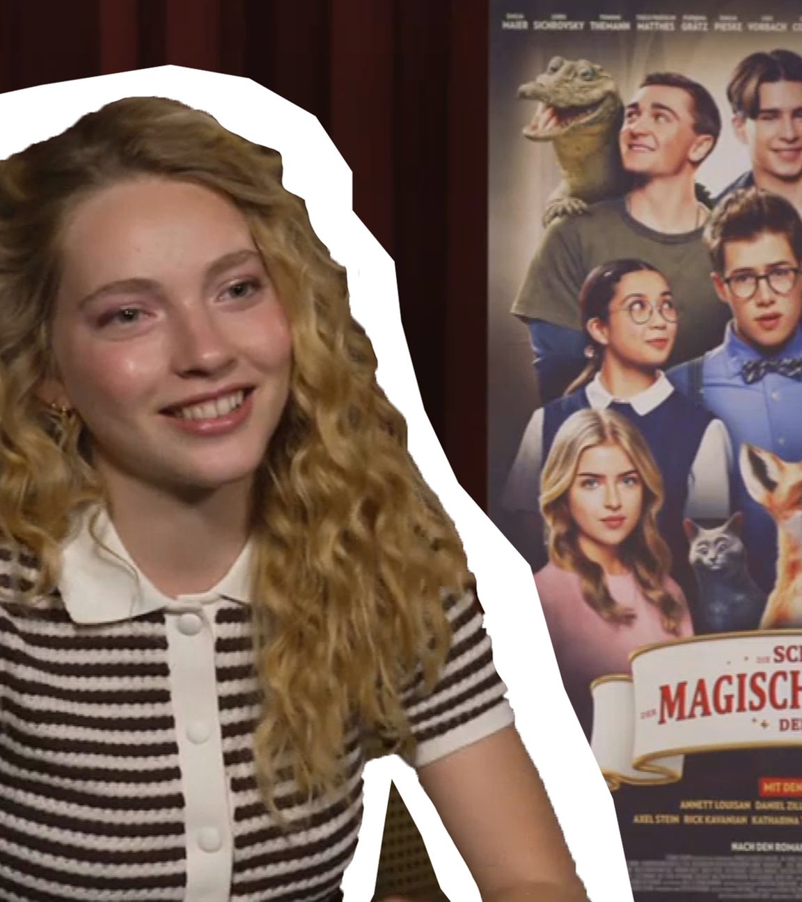 Schauspielerin Emilia Maier neben ihr das Plakat des neuen Kinofilms "Die Schule der magischen Tiere 4".