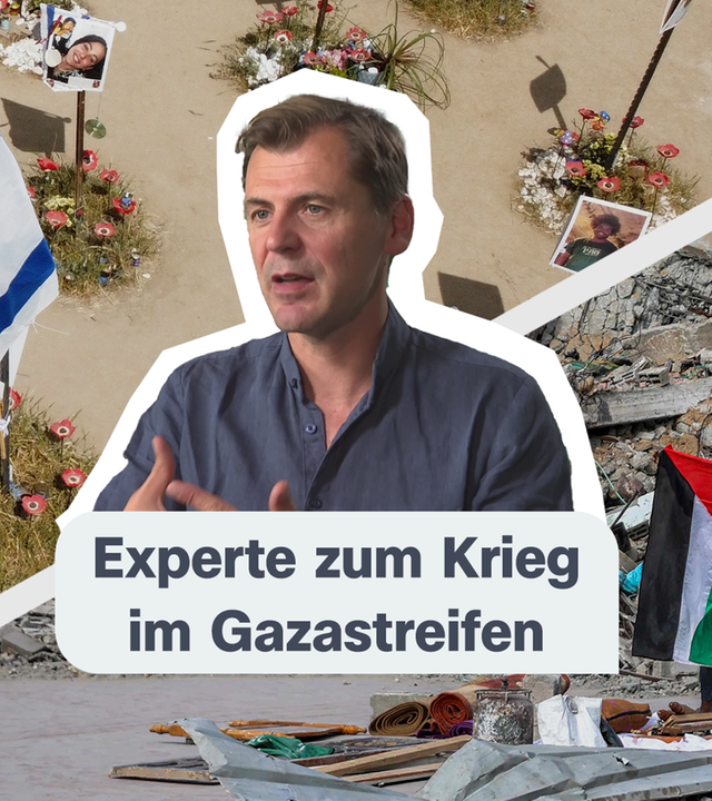Ein Mann ist im Vordergrund zu sehen. Im Hintergrund ist auf der rechten Seite ein zerstörtes Haus und eine Palästinaflagge zu erkennen. Auf der linken Seite sieht man einen israelischen Friedhof.