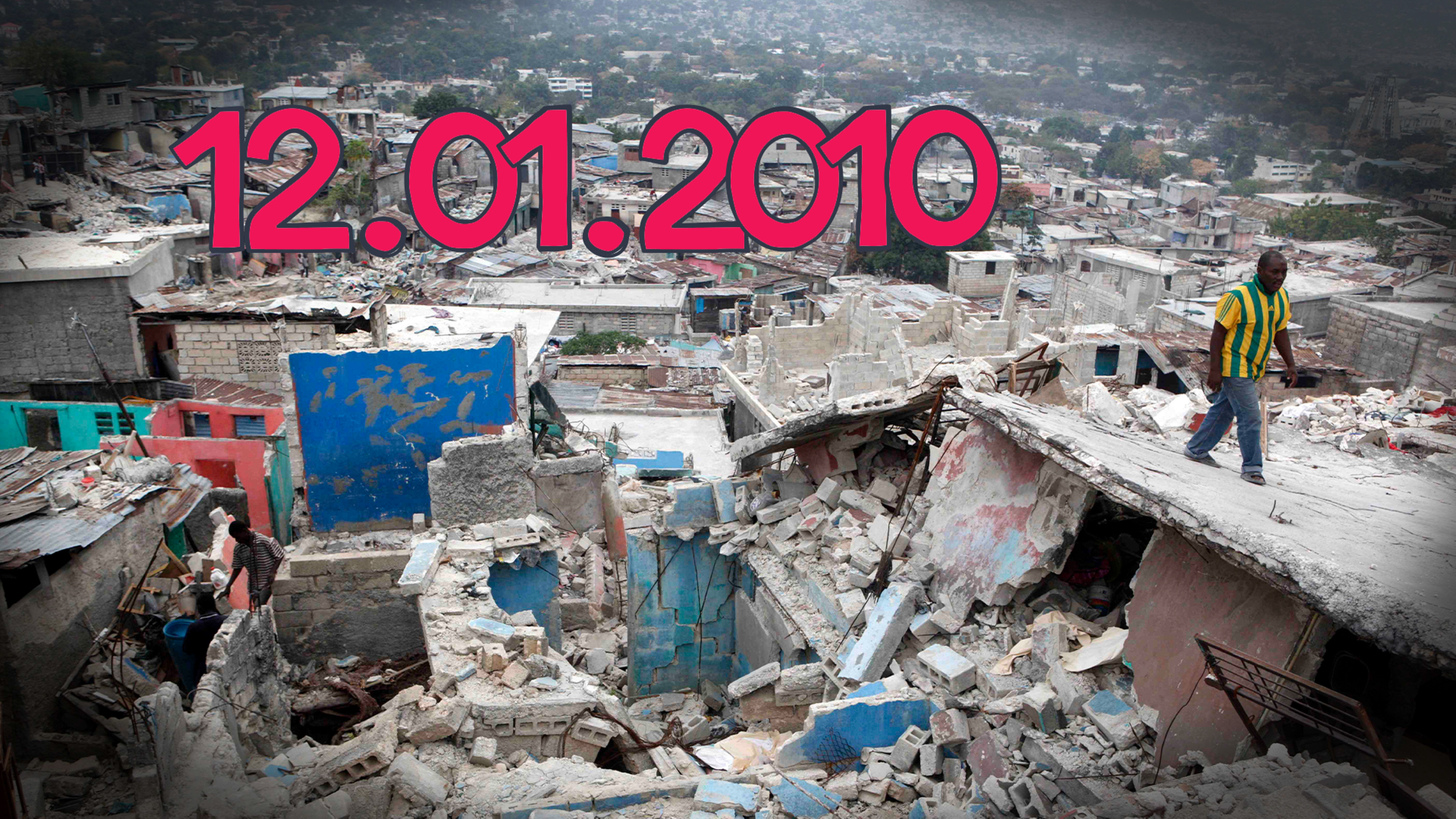 Zerstörte Gebäude, auf denen ein Mann läuft, daneben steht das Datum 12.01.2010