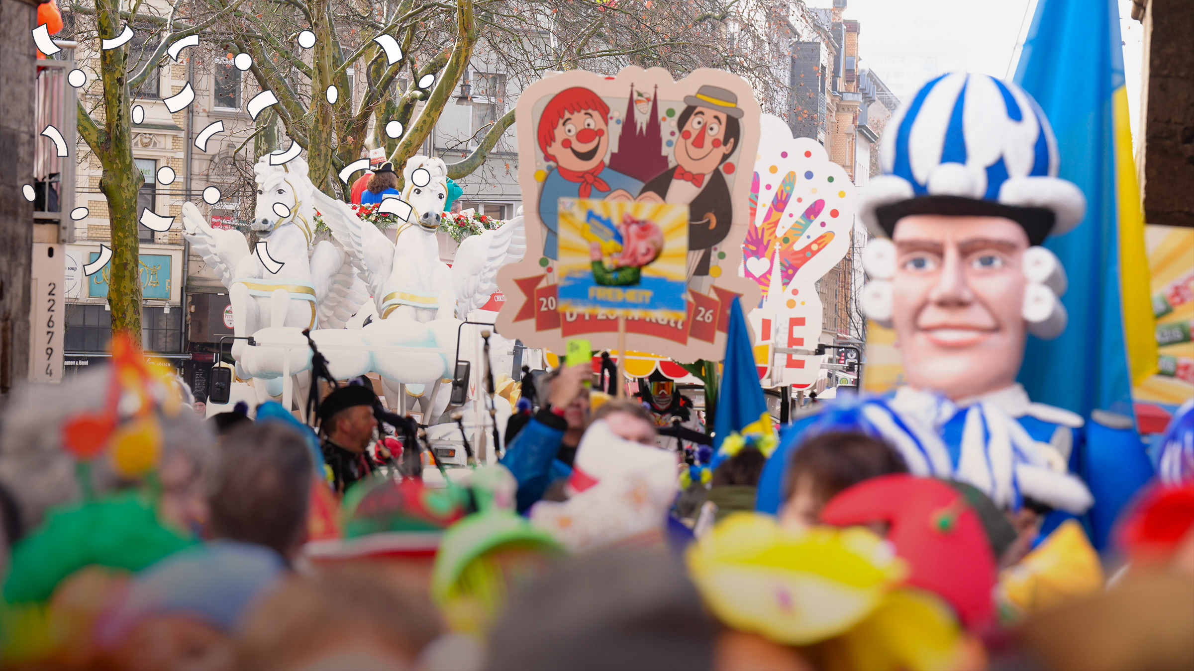 Herrscht heute in vielen Städten in Deutschland, denn es ist Rosenmontag! Auf den Umzügen gibt es Wagen, die bunt dekoriert sind, und viele Menschen in Kostümen.