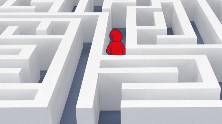 Rotes Doodlemännchen steht in Labyrinth