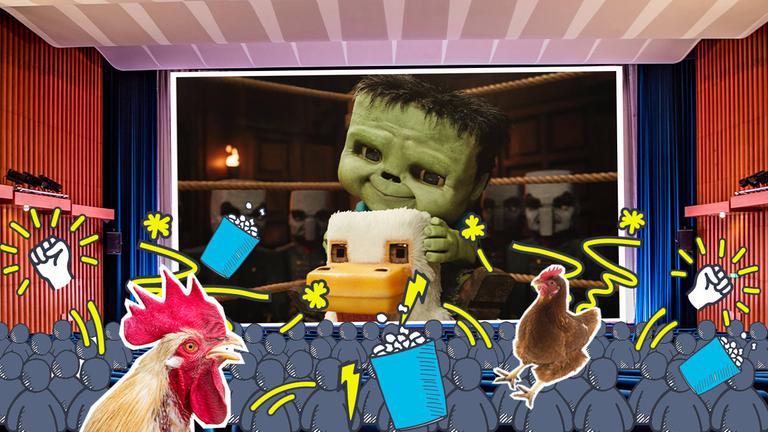 Bild aus Minecraft-Film, Kino-Saal mit Grafiken zu Chaos und Hühnern