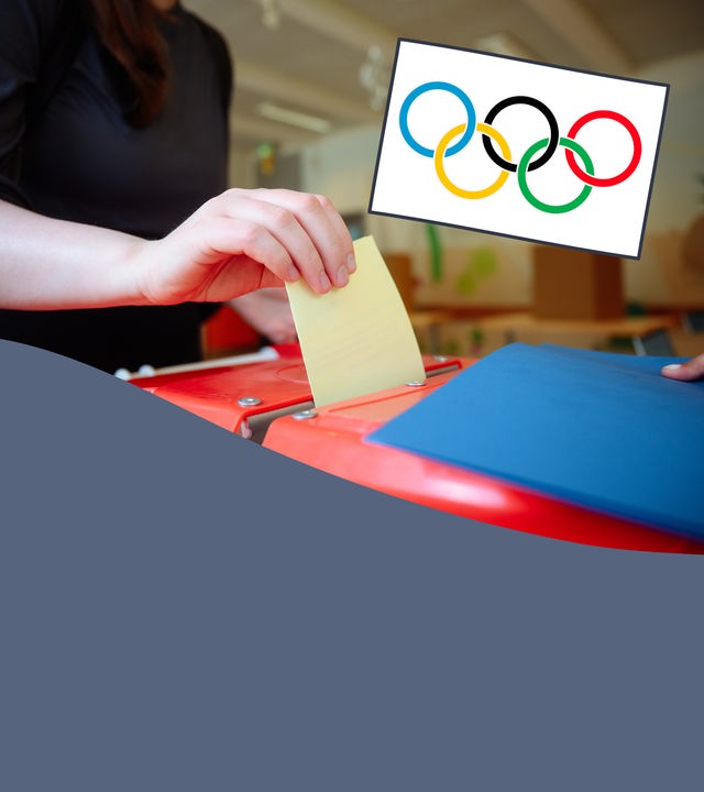 Wahlurne mit Hamburger Flagge und Symbol der Olympischen Ringe