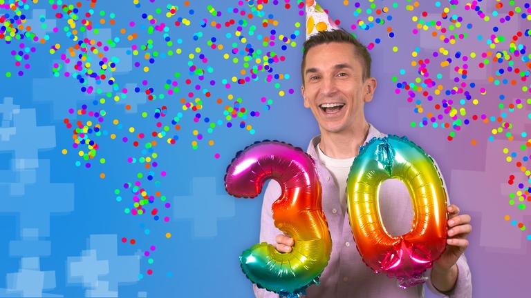 Eric mit Geburtstagshütchen, in der Hand hält er eine bunte 30. Hinter ihm fliegt Konfetti.
