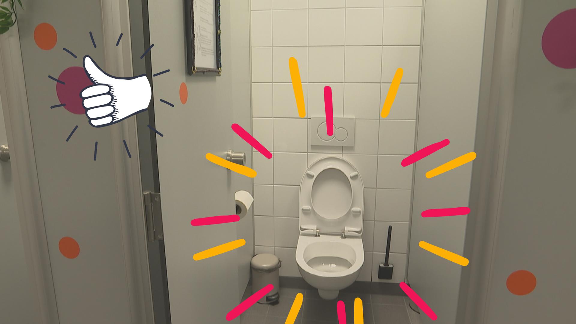 Schultoilette mit grafischen bunten Strahlen, daneben Daumen hoch
