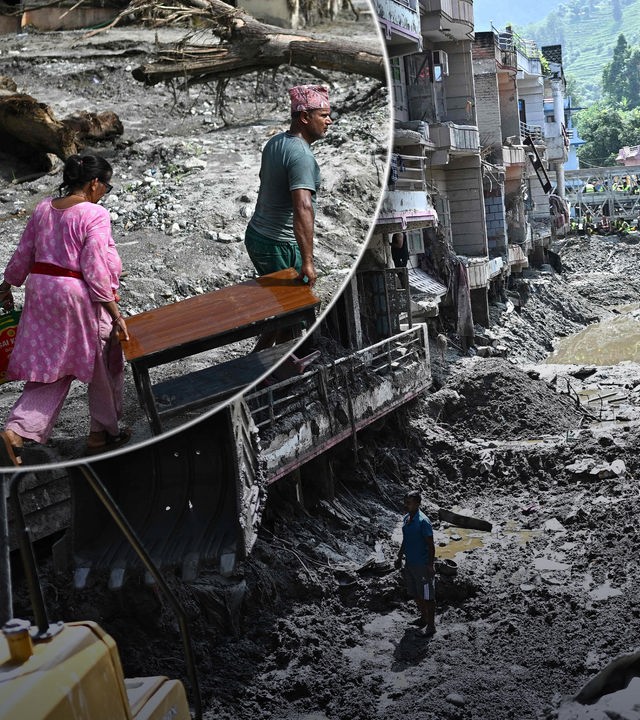 Menschen suchen nach einer Sturzflut in Nepal zwischen den Trümmern und im Schlamm nach ihren Sachen.