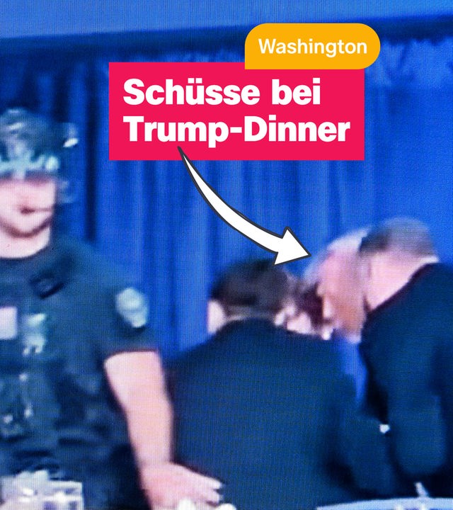 Trump, wie er von Sicherheitsleuten geschützt wird. 