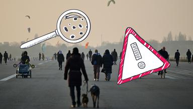 Menschen im Nebel, Lupe mit kleinen Staubteilchen