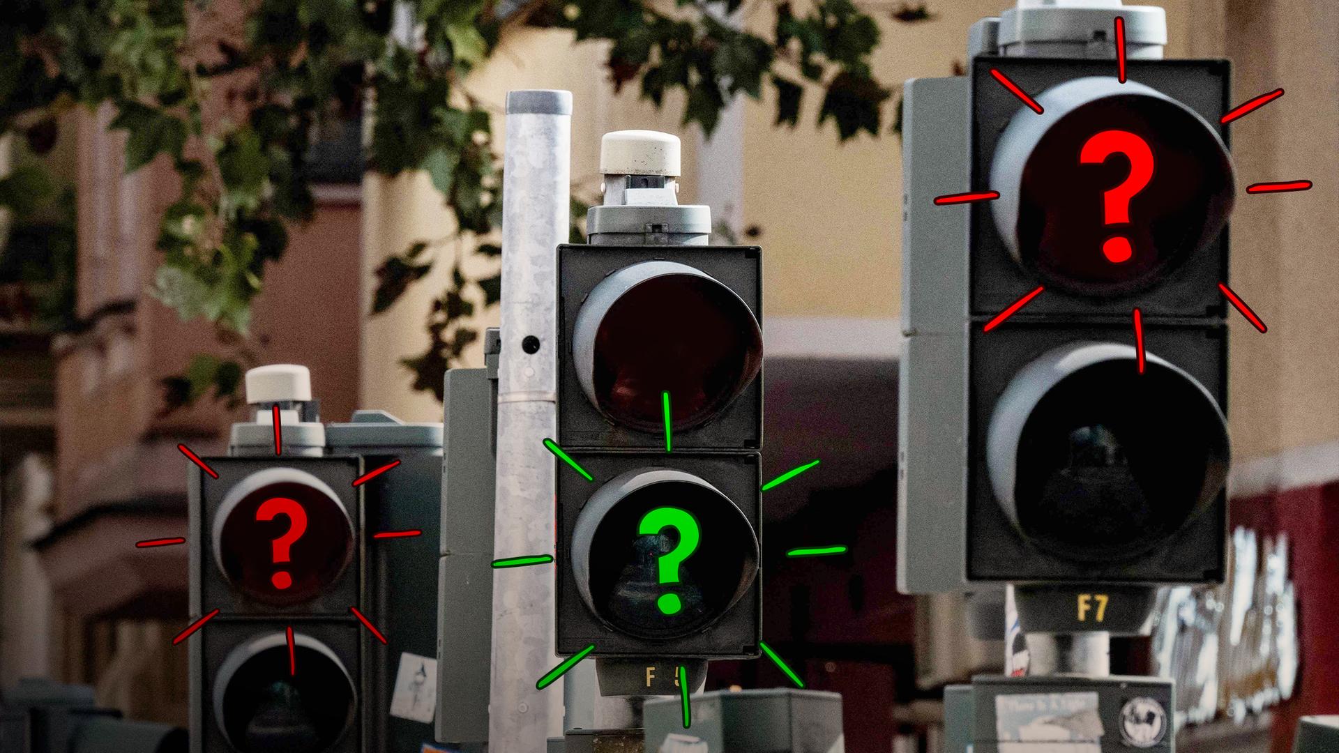 Mehrere Ampeln mit Fragezeichen drauf
