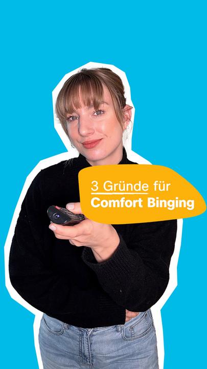 Eine blonde Frau steht mit einer Fernbedinung in der Hand vor einem neutralen Hintergrund. Daneben steht der Text: "3 Gründe für Comfort Binging"