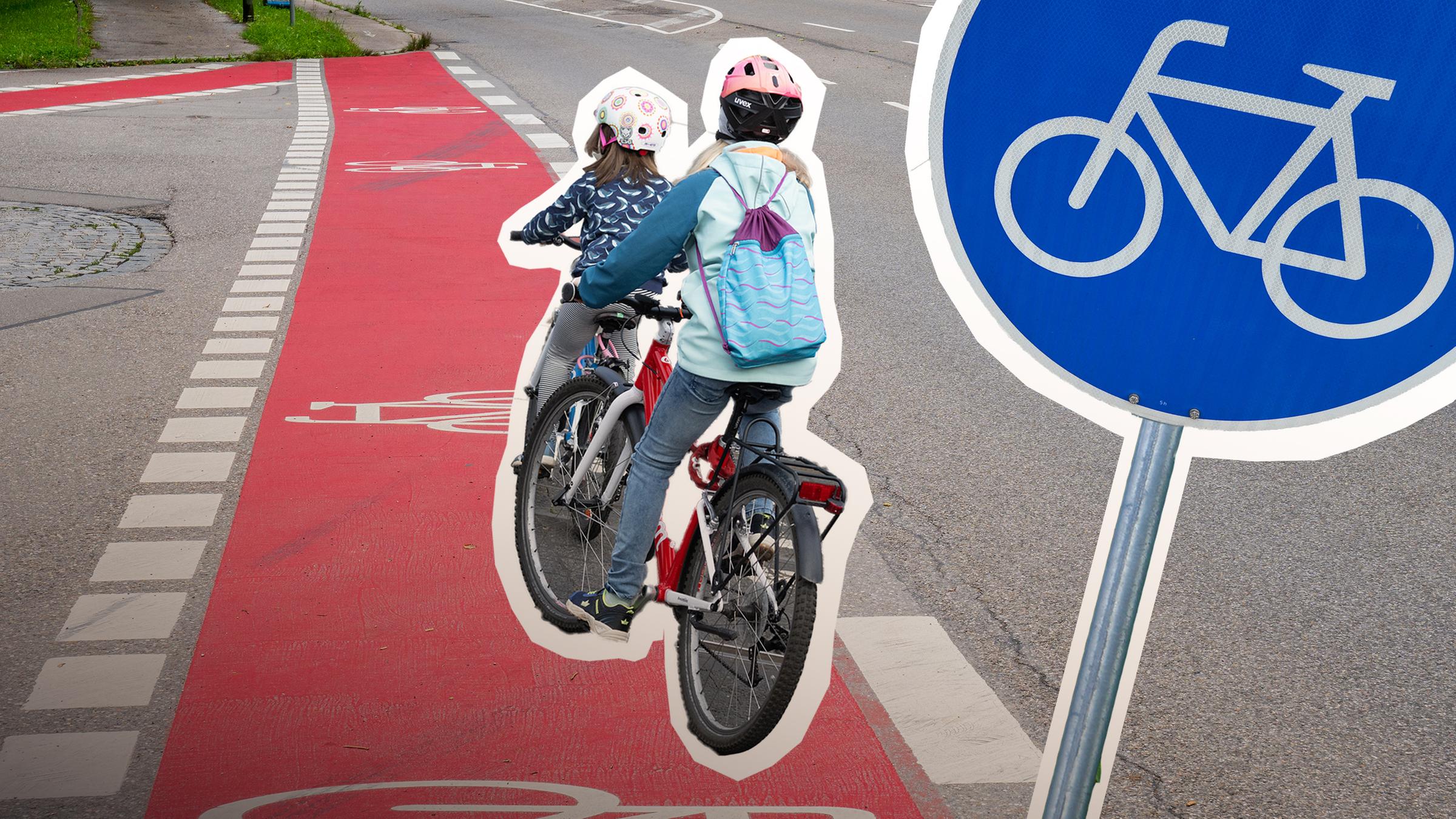 Zwei Mädchen fahren auf einem Radweg