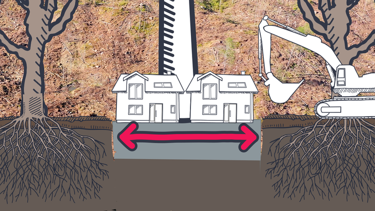 Bagger mit Windanlage und Sockel mit Häusern